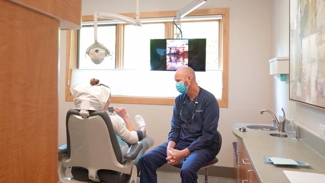 Doctor With Patient In Exam Room